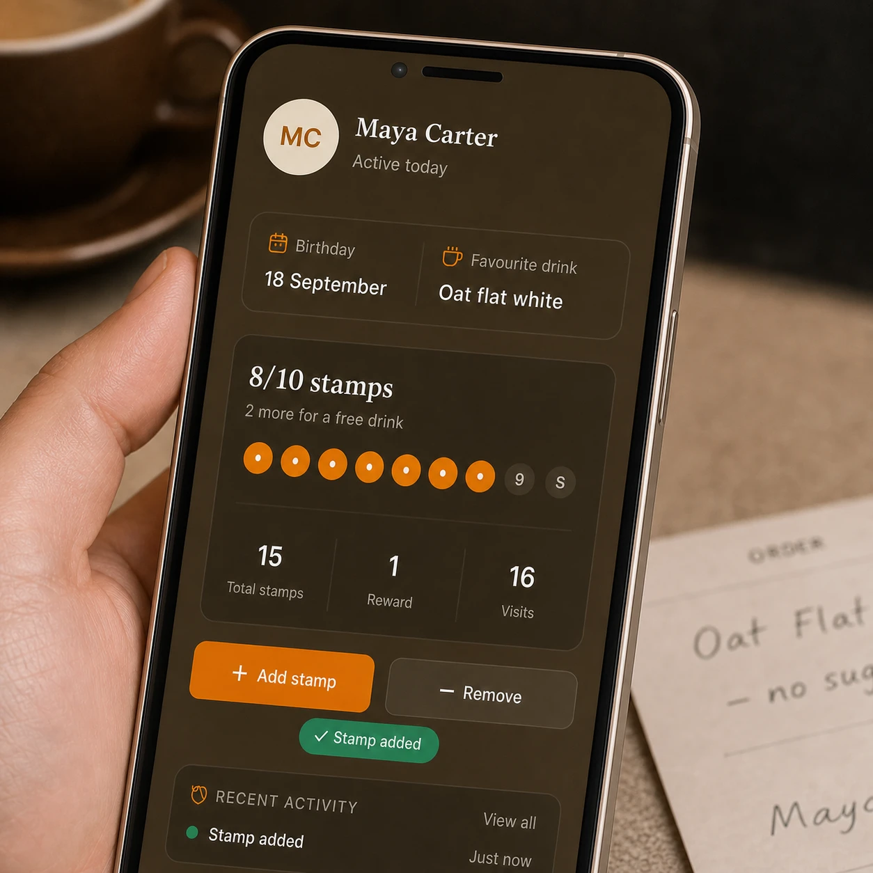Close-up of a Loytap customer profile showing a birthday, usual coffee, reward progress and recent visits.
